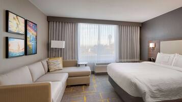 Desk, laptop workspace, blackout drapes, iron/ironing board