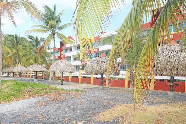 At the beach overlooking the ocean; grab a palapa and soak in the sun and sites