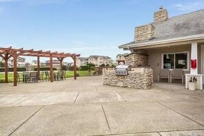 Outdoor dining - Ground Floor Beach Condo • Ocean Views • Pool • Hot Tub • Gym • Pet Friendly (Westport)