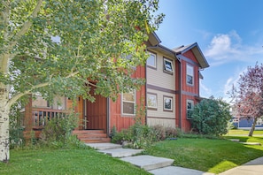 A two-story residential building with a red exterior and a front porch. - 'Bozeman Getaway' w/ Mountain Views, Near Downtown (Bozeman)