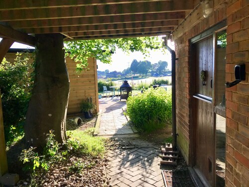 Studio & balcony with tree growing through it, private hot tub, stunning views.