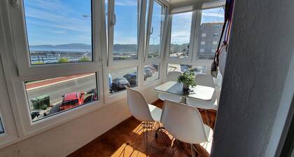 Asunto Muxíassa. Sataman edessä