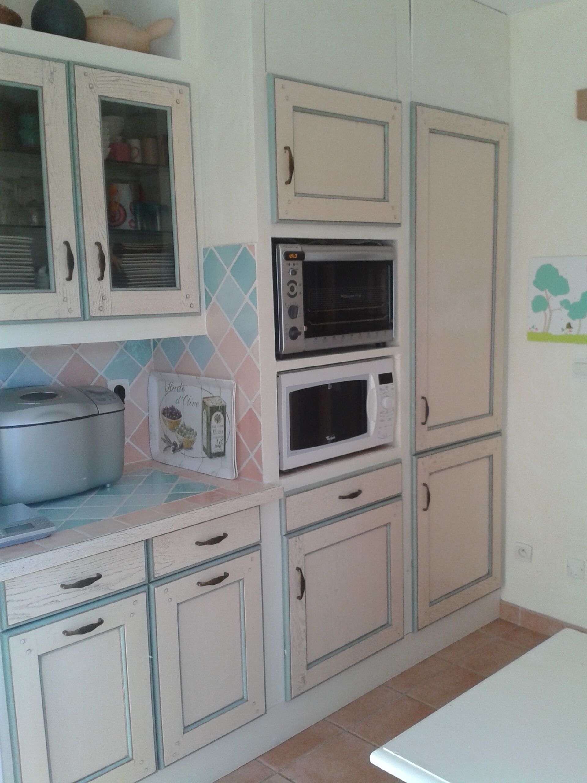 A kitchen with cabinets, a microwave, and a stove.