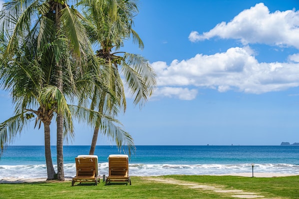 On the beach, sun loungers, beach towels