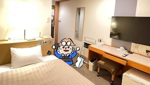 A hotel room with a bed, a desk, a television, and a trash bin. - Sabae Dai-ichi Hotel (Sabae)