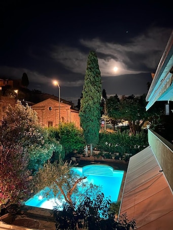 Seasonal outdoor pool, open 9 AM to 7 PM, sun loungers