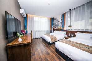 Family Room | Premium bedding, in-room safe, individually decorated, desk - MG Hotel - St. Michael's Cathedral, Qingdao (Qingdao)
