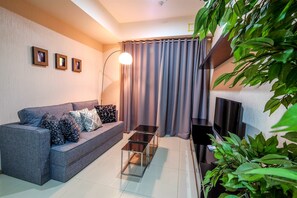 Apartment, 1 Bedroom | Living room | LCD TV - 1 Bedroom Apartment Casa Grande Residence by Travelio (Jakarta)