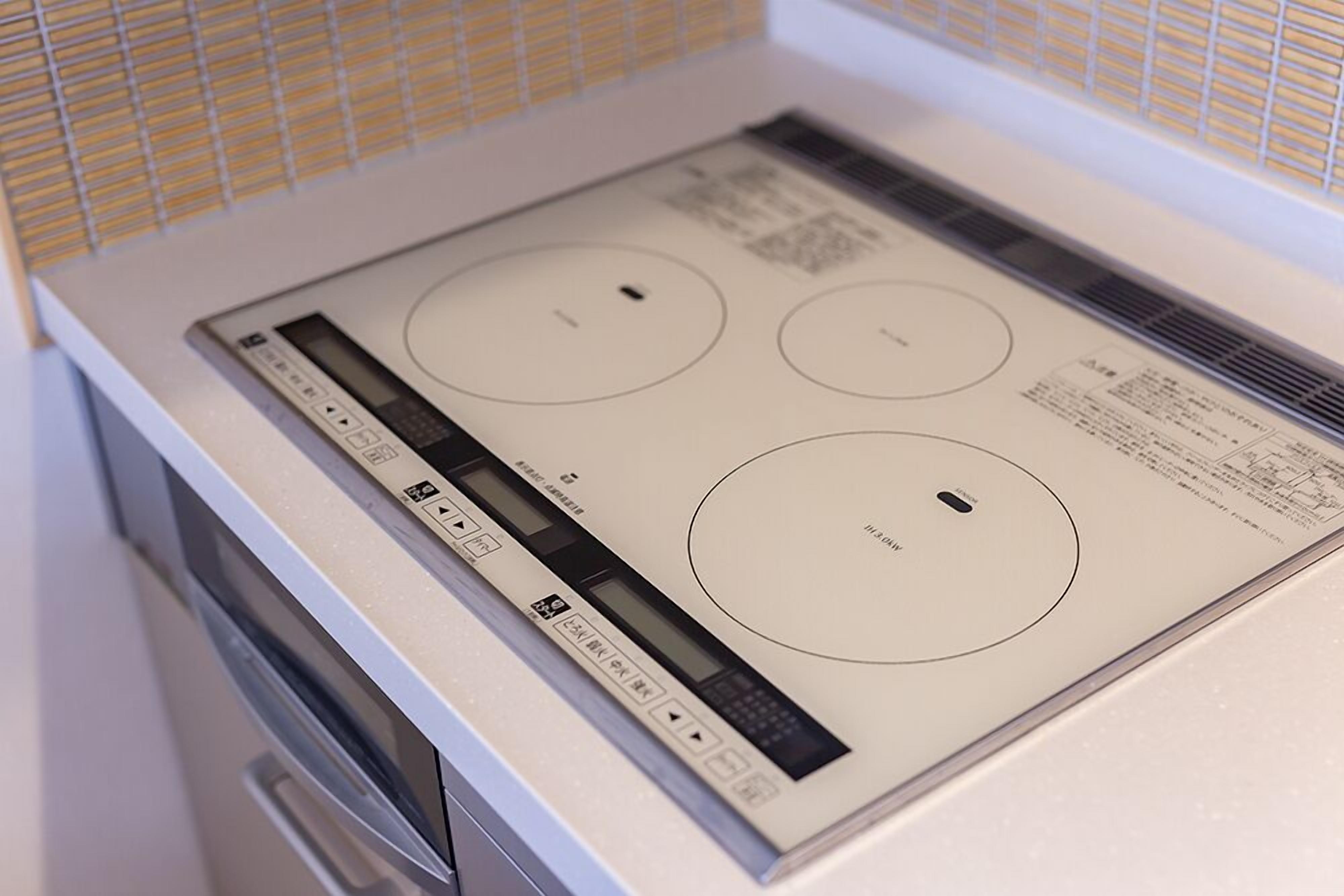 A kitchen with a built-in stovetop and oven.