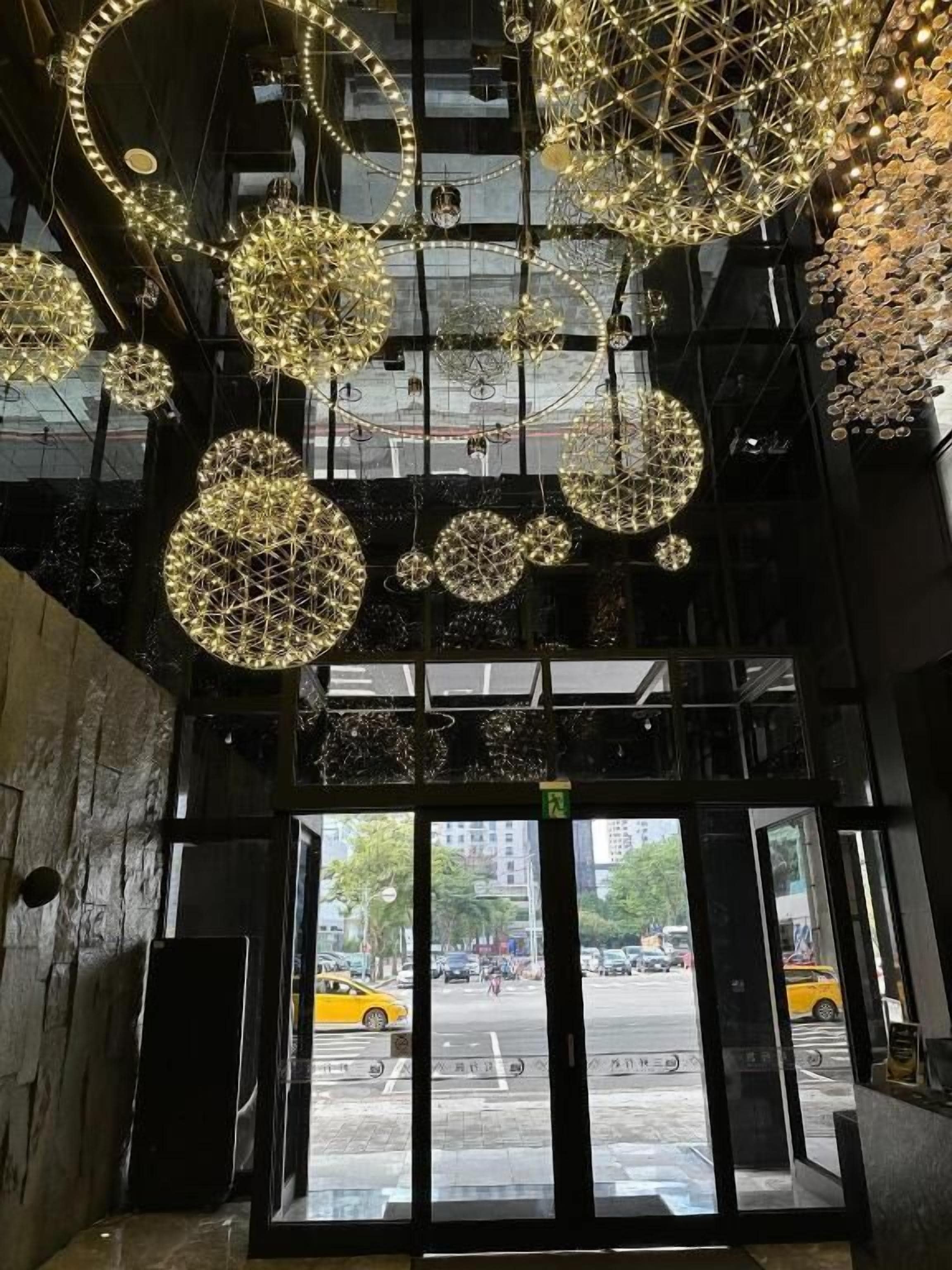 A building entrance with a glass door and a view of the street outside.