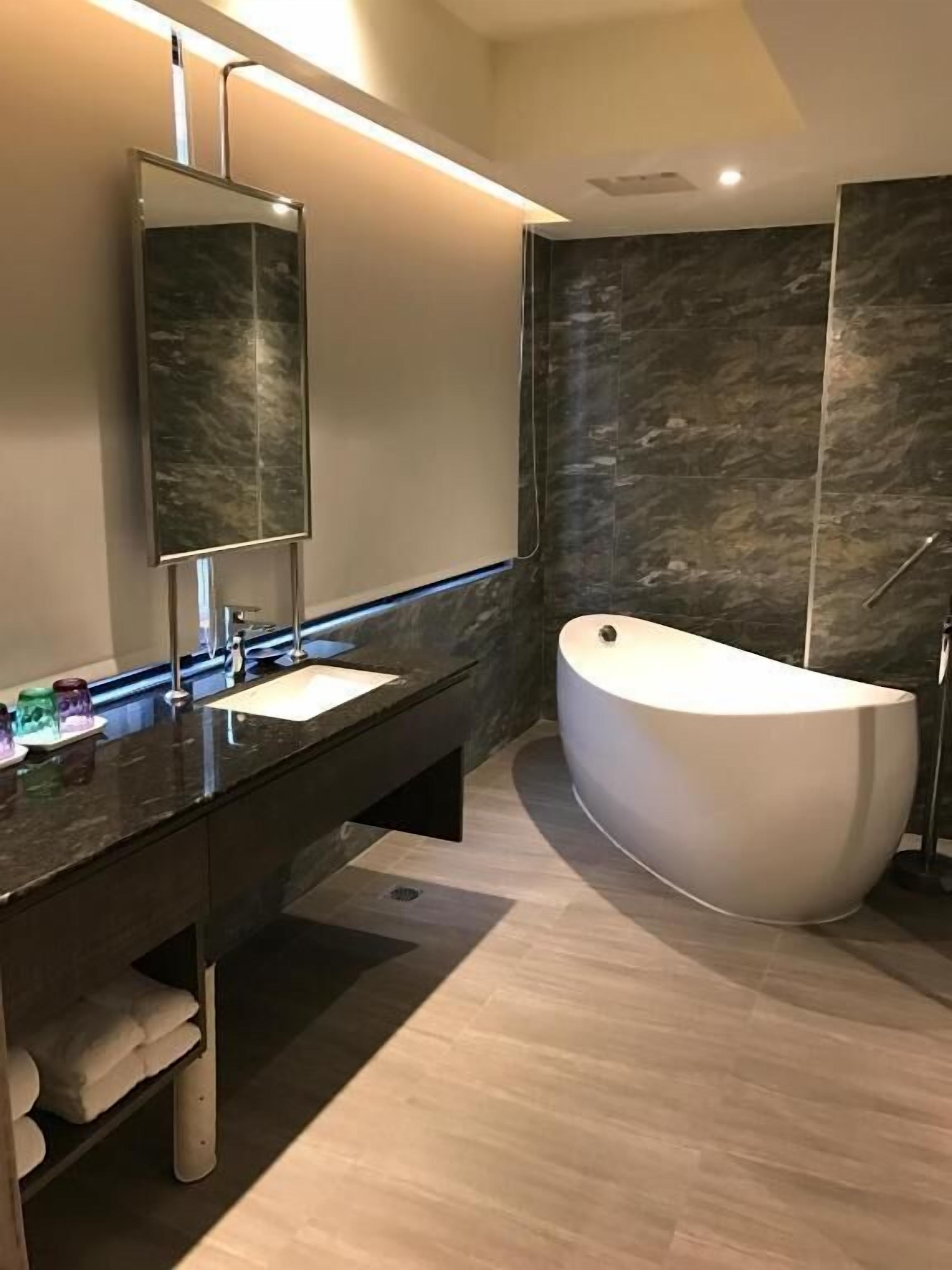 shower, rainfall showerhead, hair dryer, slippers