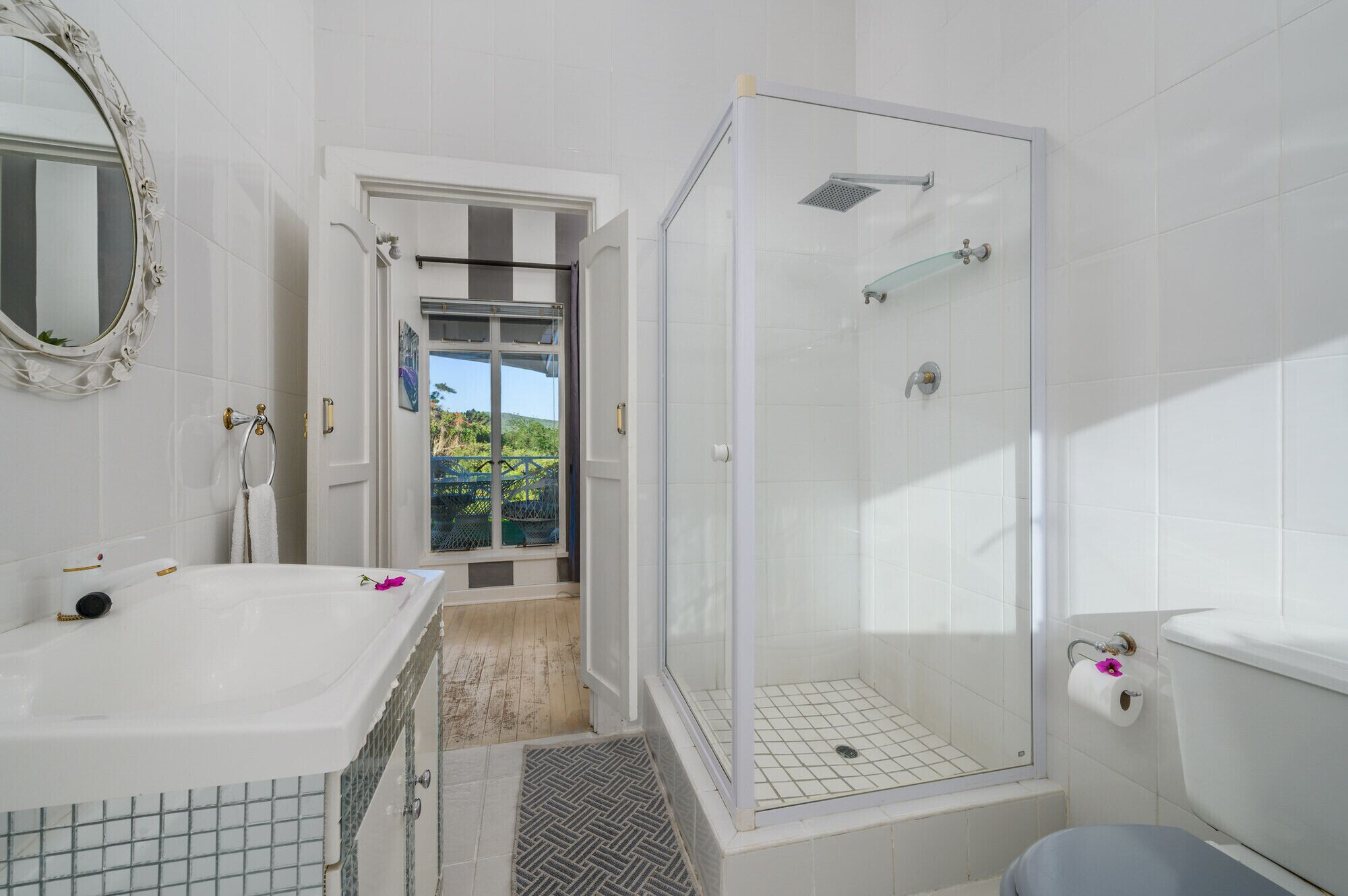 A bathroom with a bathtub, toilet, and shower.