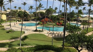 A resort with multiple swimming pools, palm trees, and a beach area. - Deluxe Room w/King Bd, Ocean/Pool views, New Furnishings!, No Resort Fee (Lihue)