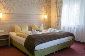 Luxe beddengoed, een minibar, een kluis op de kamer, een bureau