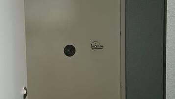 A closed door with a keyhole and a lock.