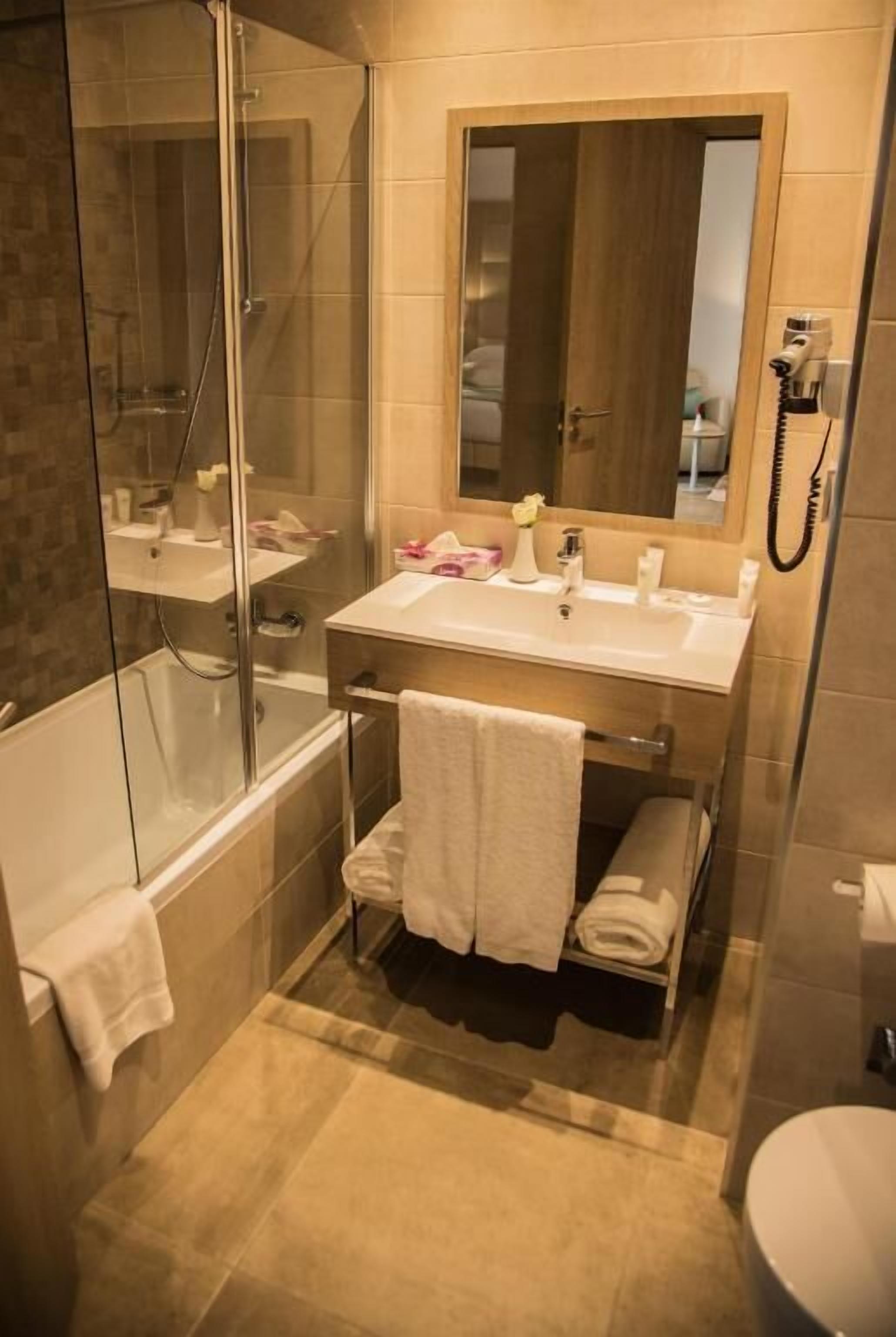 shower, free toiletries, hair dryer, towels