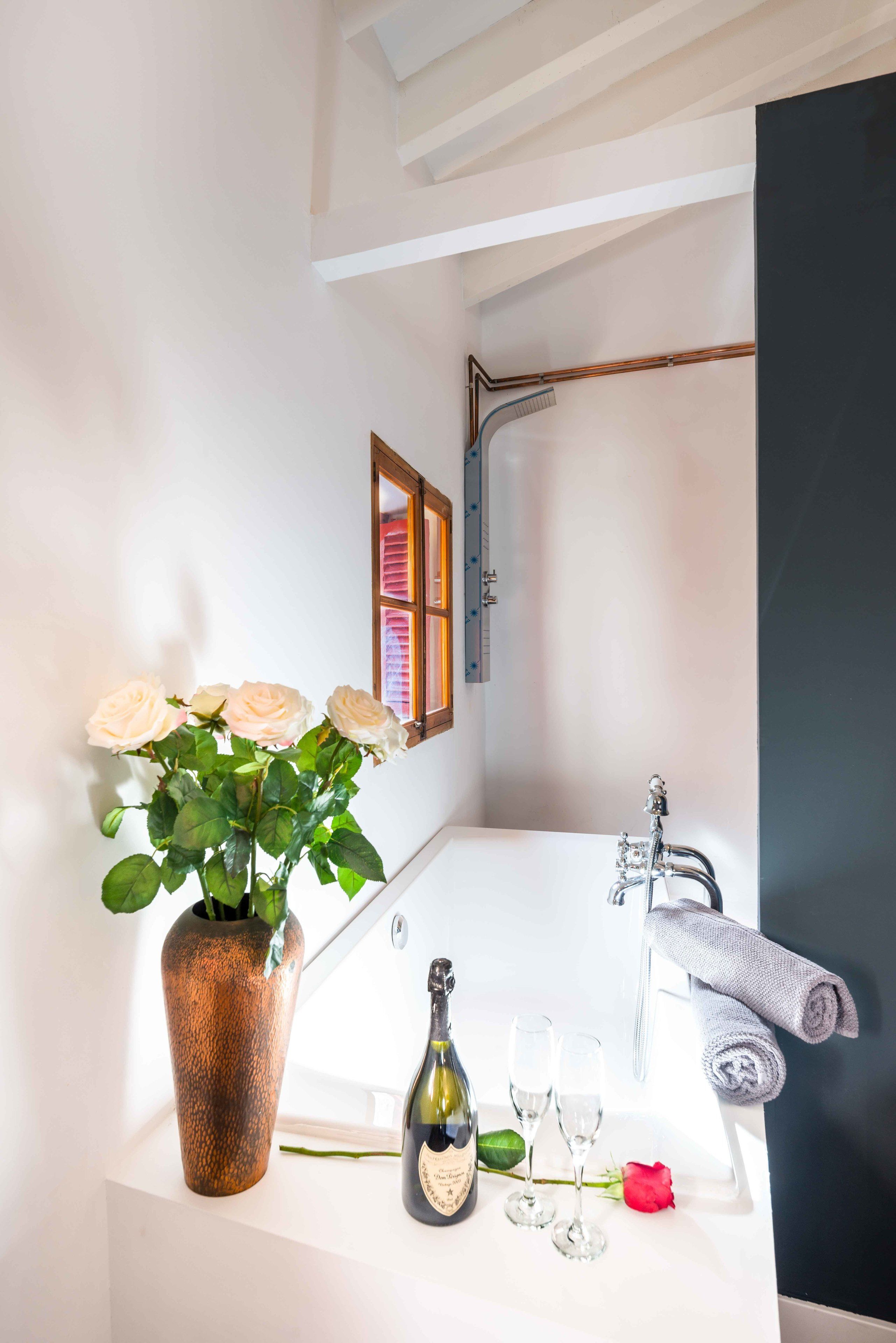 suite | bathroom | deep-soaking bathtub, rainfall showerhead, free toiletries, hair dryer