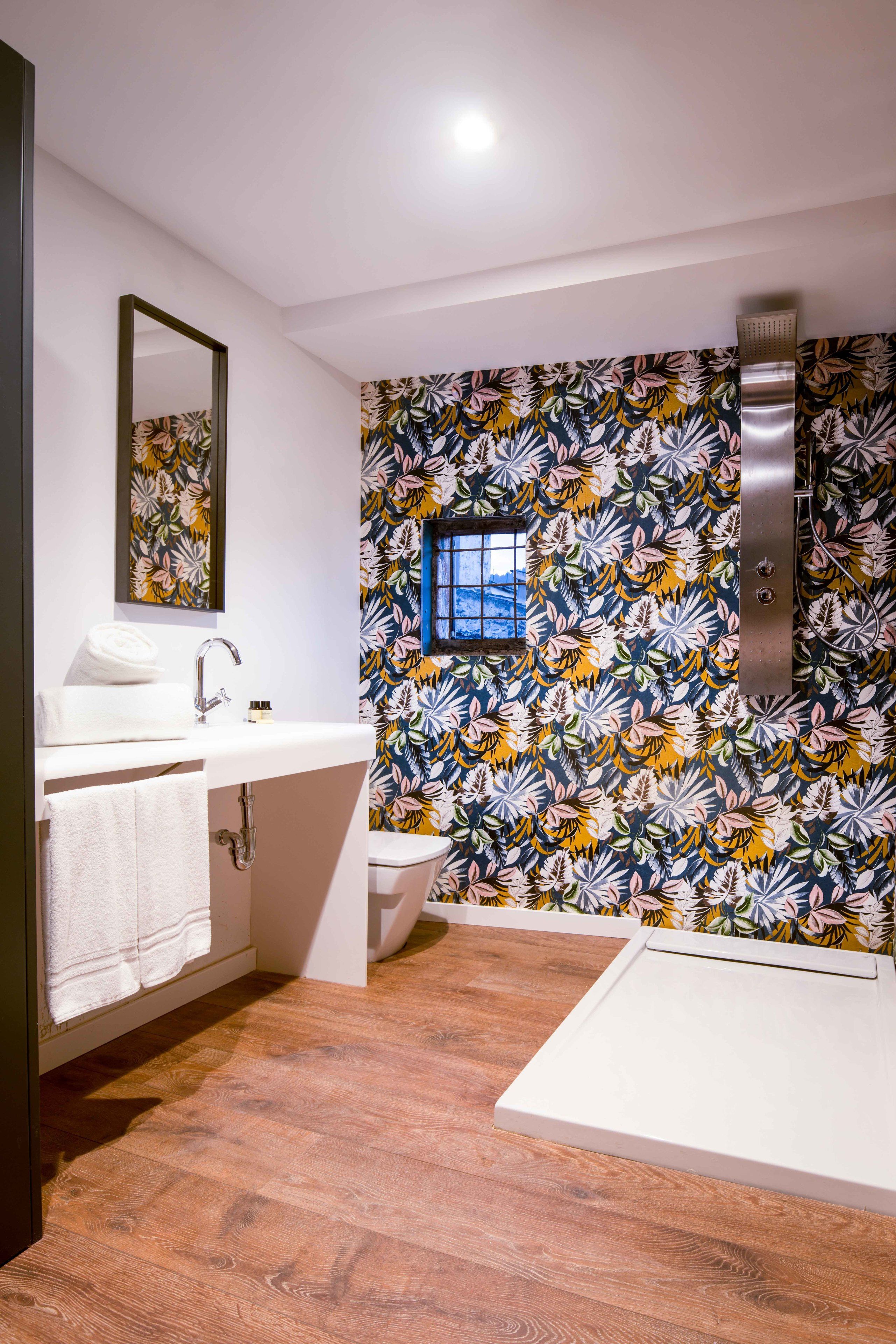 deep-soaking bathtub, rainfall showerhead, free toiletries, hair dryer