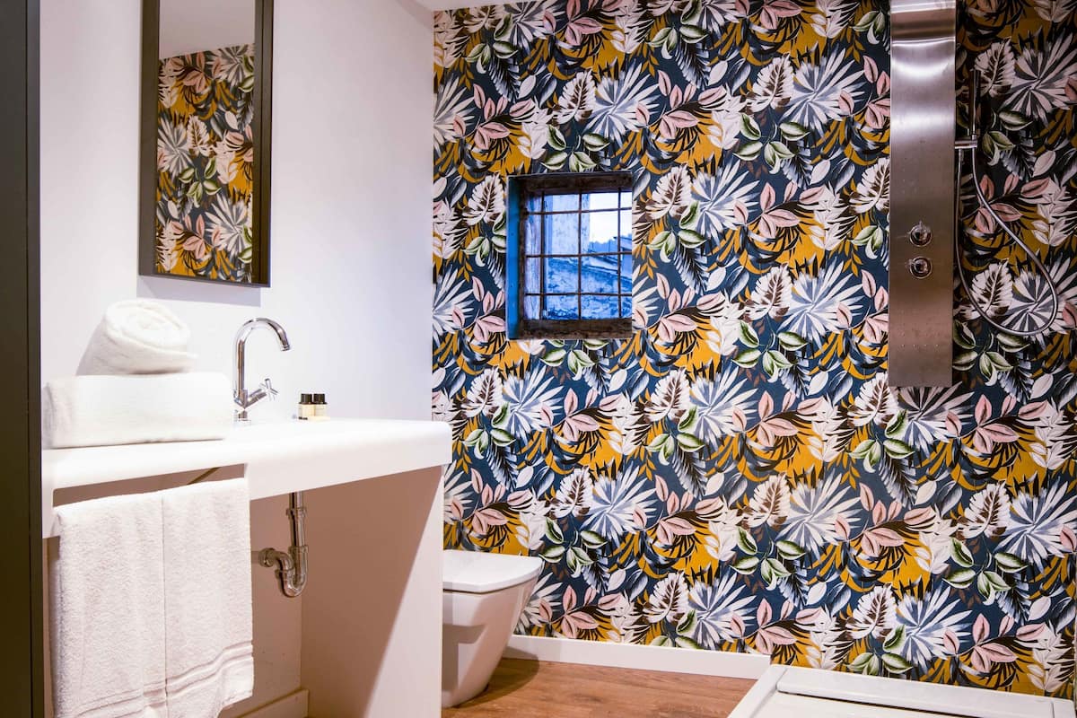 deep-soaking bathtub, rainfall showerhead, free toiletries, hair dryer