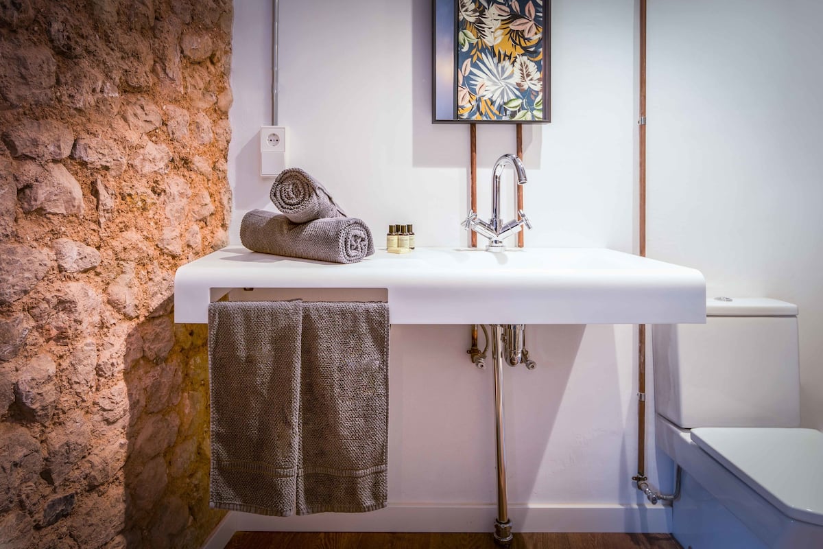 deep-soaking bathtub, rainfall showerhead, free toiletries, hair dryer