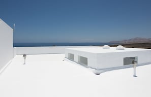 Suíte júnior, terraço, vista para o oceano | Terraço/pátio