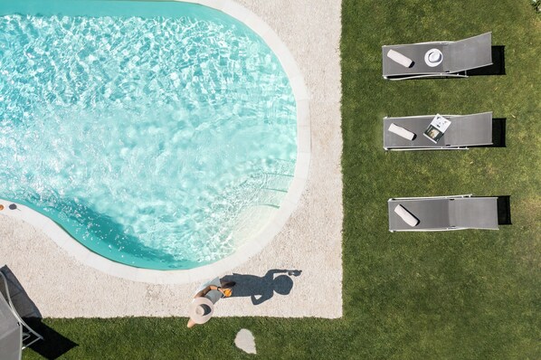 Seasonal outdoor pool, pool umbrellas, pool loungers