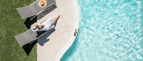 Seasonal outdoor pool, pool loungers