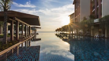 Outdoor pool, open 7:00 AM to 7:00 PM, pool umbrellas, pool loungers