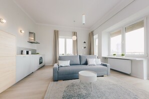 Appartement Premium, 1 grand lit et 1 canapé-lit, vue ville | Coin séjour