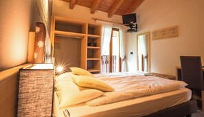 Superior Triple Room | Living area | Flat-screen TV