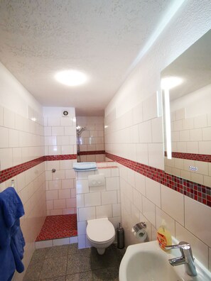 Apartment | Bathroom | Deep soaking tub, hair dryer, towels, toilet paper