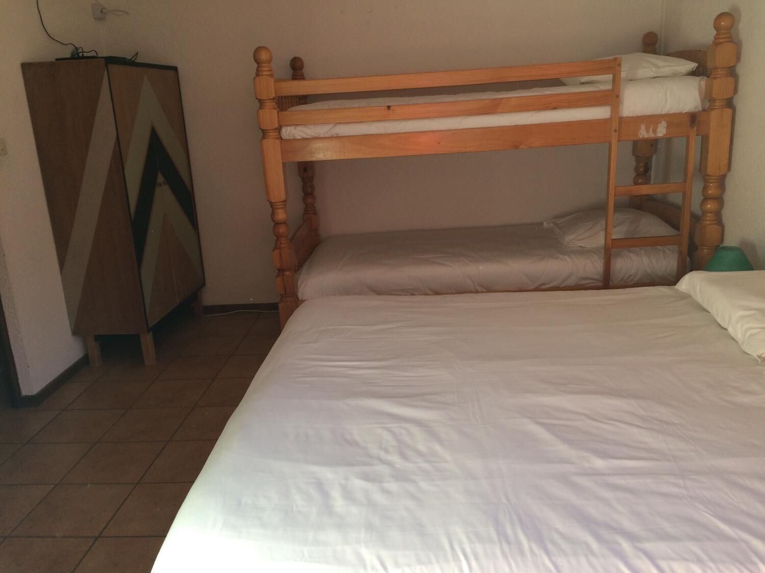 economy quadruple room | blackout curtains, bed sheets, wheelchair access
