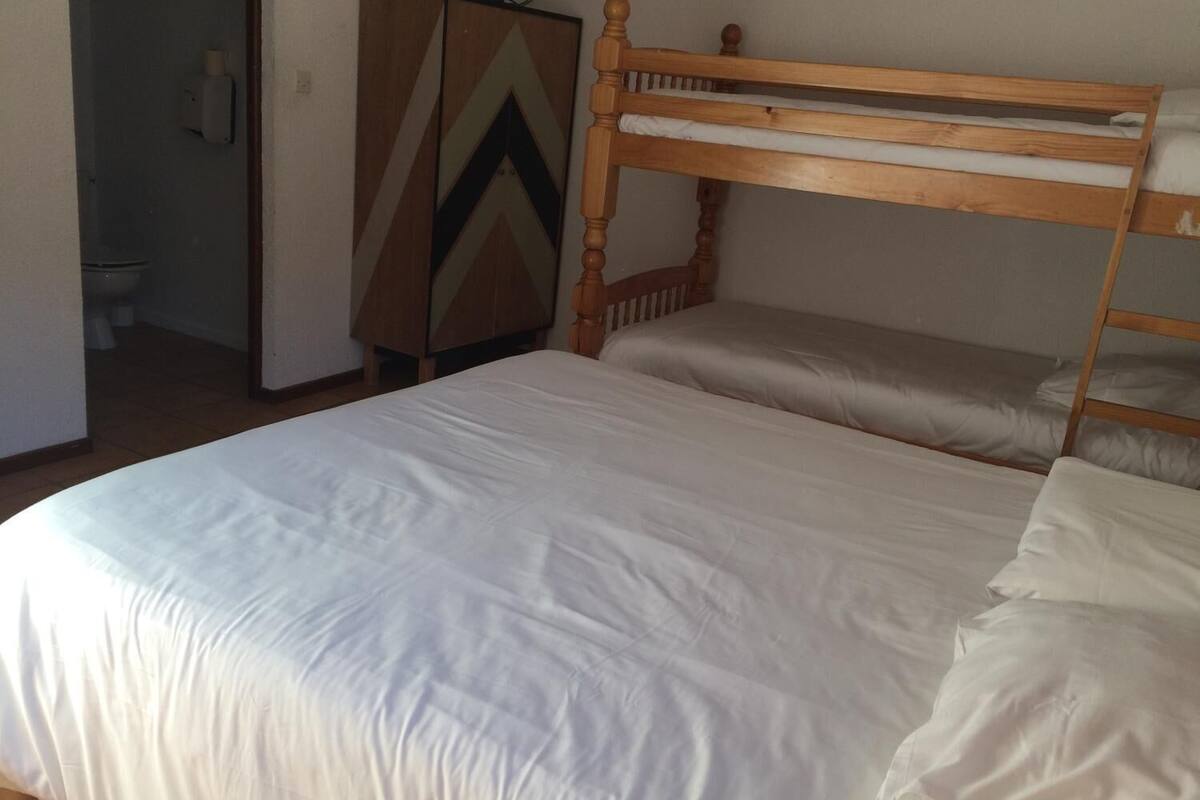 economy quadruple room | blackout curtains, bed sheets, wheelchair access