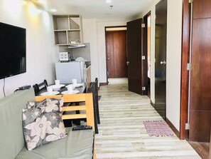 2BR Condominium | Desk, iron/ironing board, free WiFi, bed sheets