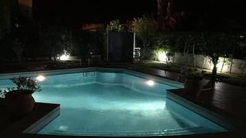 Outdoor pool, a heated pool, sun loungers