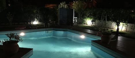 Outdoor pool, a heated pool, pool loungers