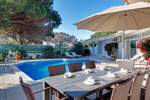 Outdoor pool, a heated pool, pool loungers