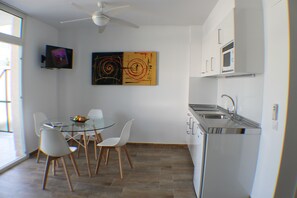 Fridge, microwave, coffee/tea maker, cookware/dishes/utensils