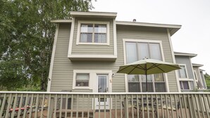 A two-story house with a covered patio area. - Experience All 7 Springs Has to Offer in This Great Townhouse (Champion)