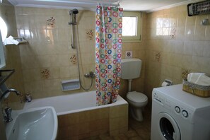 Family House | Bathroom | Combined shower/tub, hair dryer, towels, soap - Casa Della Felicitá (Kefalonia)