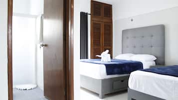 Basic Studio Suite, 2 Double Beds | Bathroom | Shower, free toiletries, hair dryer, towels