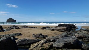 A rocky beach with waves crashing onto the shore. - Stunning uninterrupted moorland views over lake and Rough Tor (Advent)