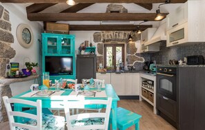 Fridge, stovetop, dishwasher, coffee/tea maker