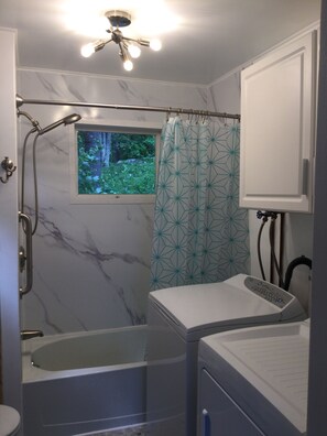 Combined shower/bathtub, hair dryer, towels, toilet paper - Tranquil Lakefront Cottage Near Acadia Nat’l Park. (Ellsworth)