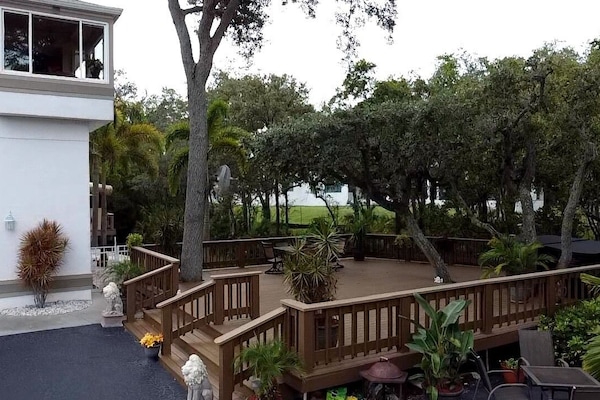 Large 1,000 square foot deck on the right side of house, overlooking the stream