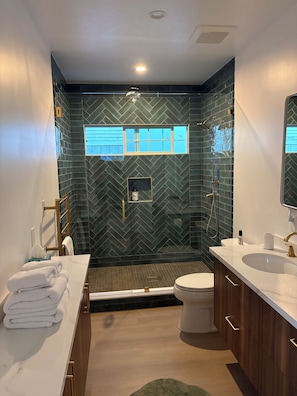 Bathtub, hair dryer, towels, soap