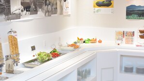 A buffet setup with various food items and condiments. - Hotel Abest Grande Okayama (Okayama)