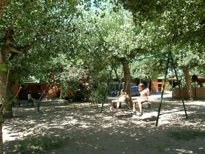 Children’s area - APCOSTAS Camping Playa y Fiesta Bungalow / Two Bedrooms (Miami Platja)