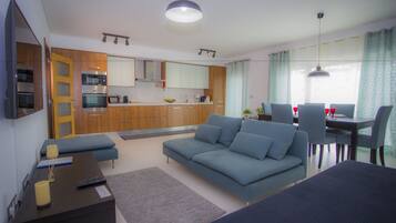 Deluxe Apartment, 2 Bedrooms, Non Smoking, Balcony | Living area | Toys