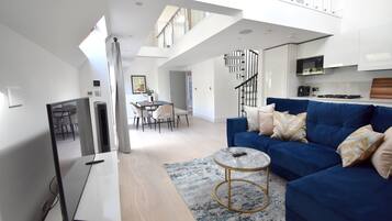 Deluxe Apartment, 2 Bedrooms, 2 Bathrooms, Mezzanine | Living area | 50-inch flat-screen TV with digital channels, TV, Netflix